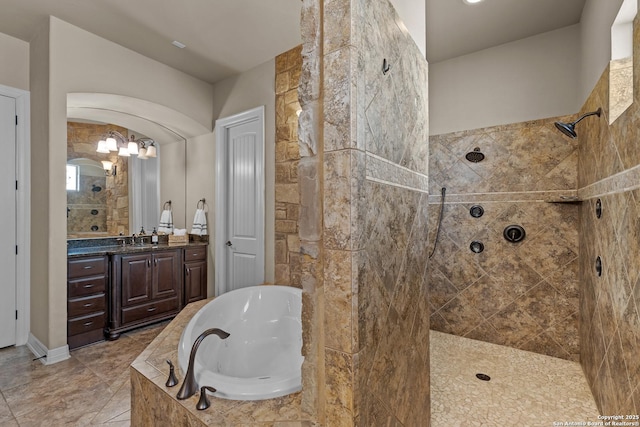 full bathroom with a walk in shower, a garden tub, and vanity