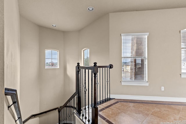 stairway with recessed lighting and baseboards