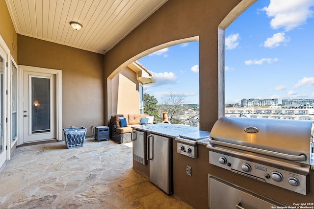 view of patio featuring an outdoor kitchen and area for grilling