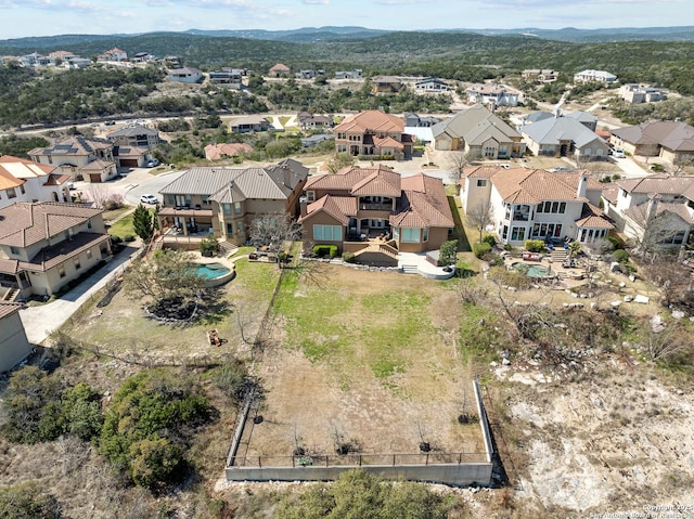 birds eye view of property with a residential view