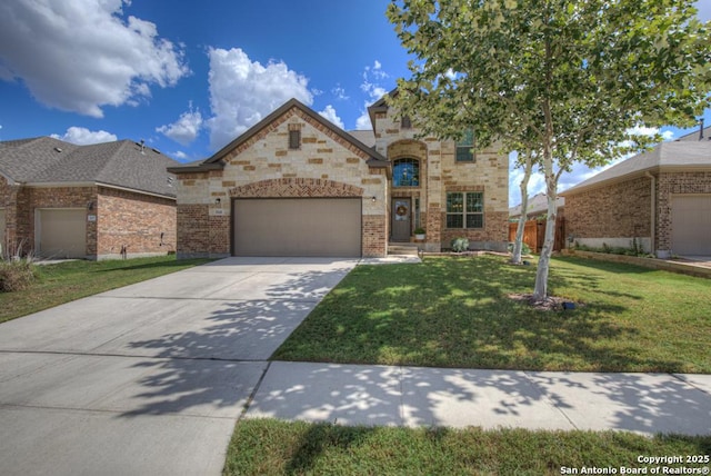 view of front of house featuring an attached garage, brick siding, concrete driveway, and a front yard