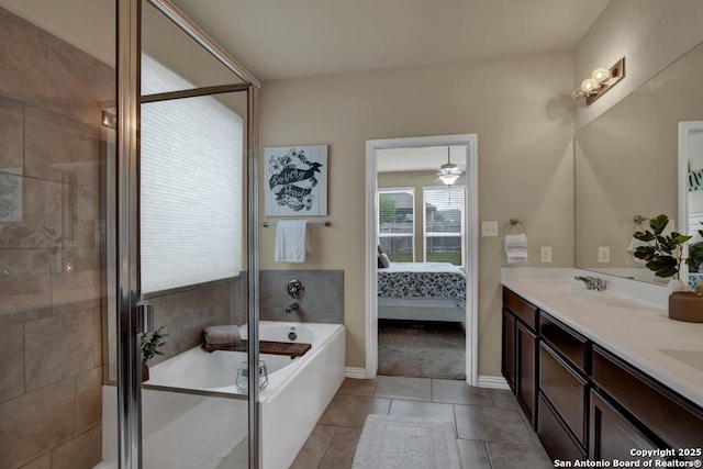 ensuite bathroom featuring a tub to relax in, double vanity, ensuite bathroom, tile patterned flooring, and a shower stall