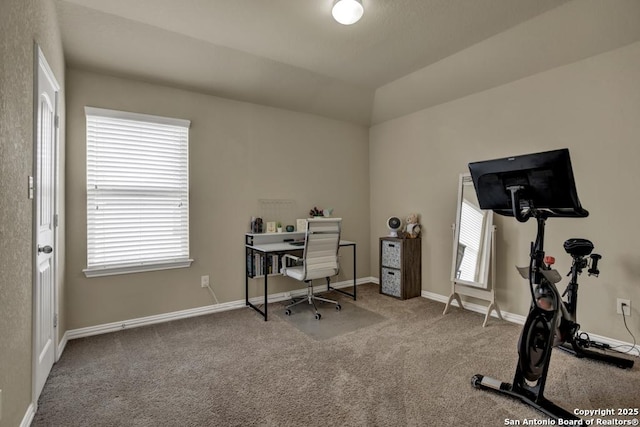 carpeted office space featuring baseboards