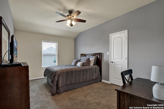 carpeted bedroom with lofted ceiling, baseboards, and a ceiling fan