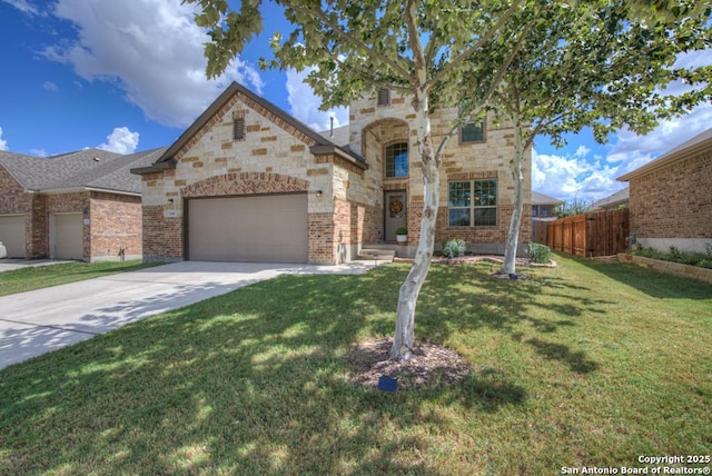 view of front of house with driveway, an attached garage, fence, and a front lawn