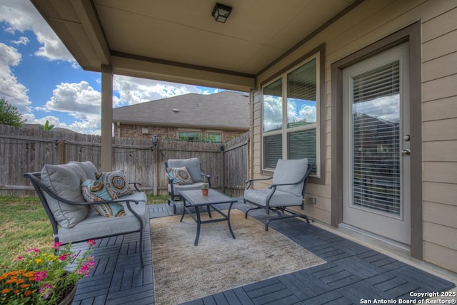 view of patio / terrace featuring fence