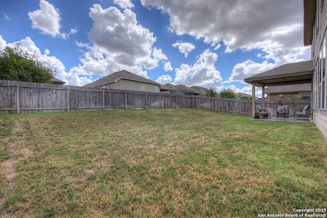 view of yard featuring a fenced backyard and a patio