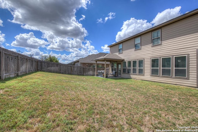 view of yard with a fenced backyard