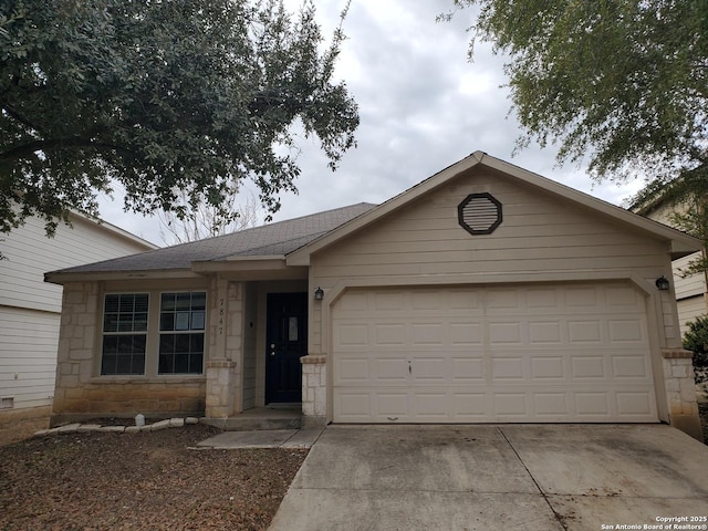 ranch-style house with stone siding, roof with shingles, an attached garage, and concrete driveway