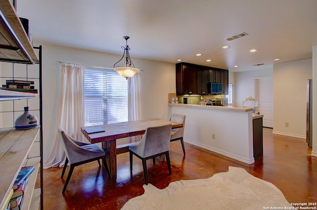 dining area with baseboards, visible vents, and recessed lighting