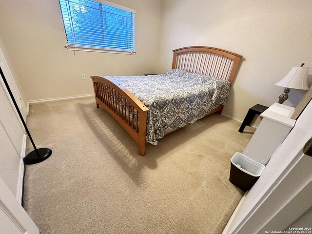 carpeted bedroom with baseboards