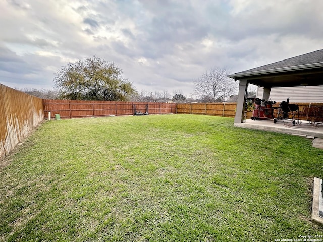 view of yard with a fenced backyard and a patio