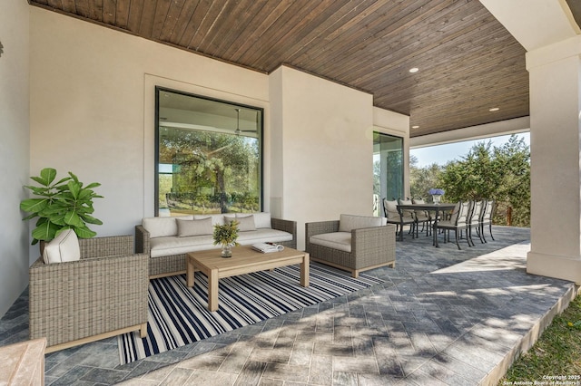 view of patio with an outdoor hangout area and outdoor dining space