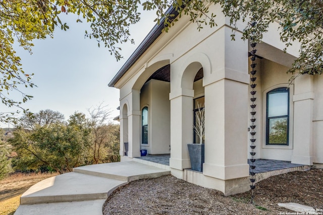 property entrance featuring stucco siding