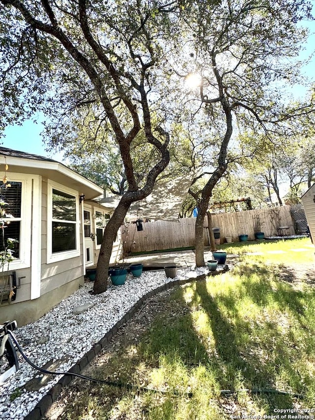 view of yard featuring fence