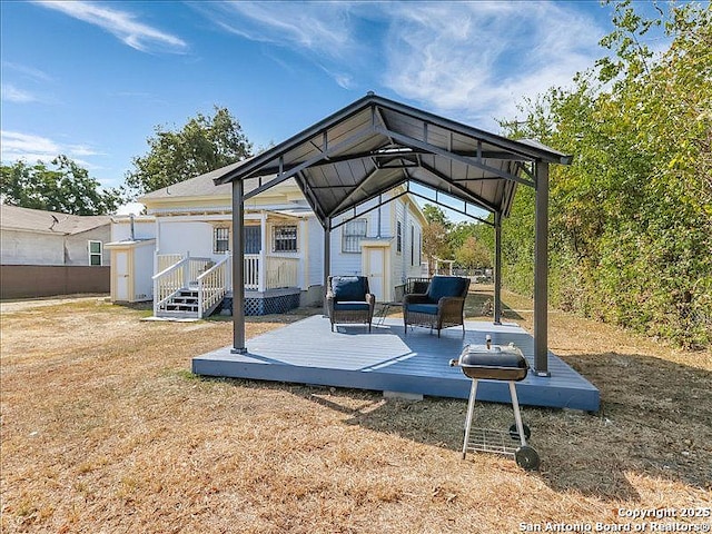 view of parking / parking lot featuring a storage shed and a gazebo