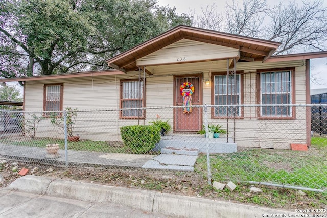 view of front of property featuring a porch and fence