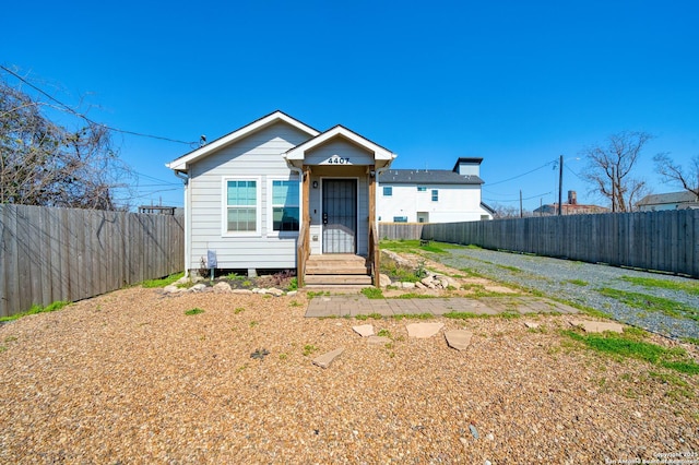 bungalow featuring fence private yard