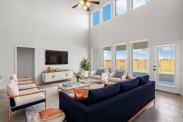 living room with ceiling fan and plenty of natural light