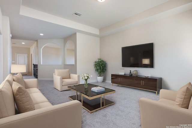 living room with carpet, visible vents, baseboards, and recessed lighting