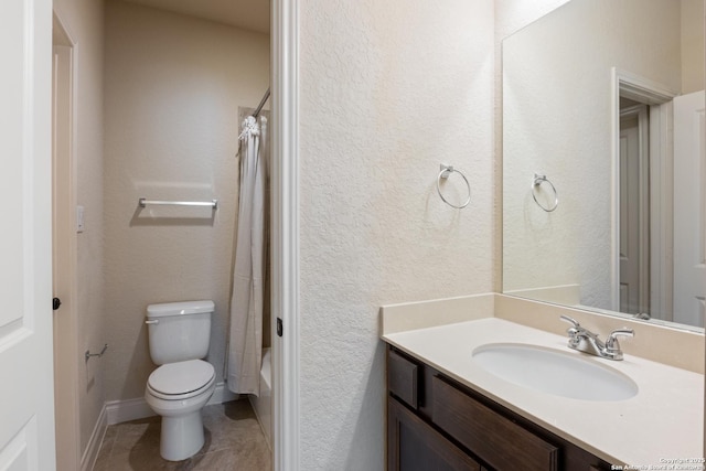 full bath featuring shower / tub combo with curtain, a textured wall, toilet, vanity, and tile patterned flooring