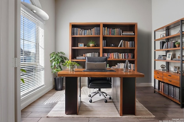 office featuring baseboards and wood finished floors