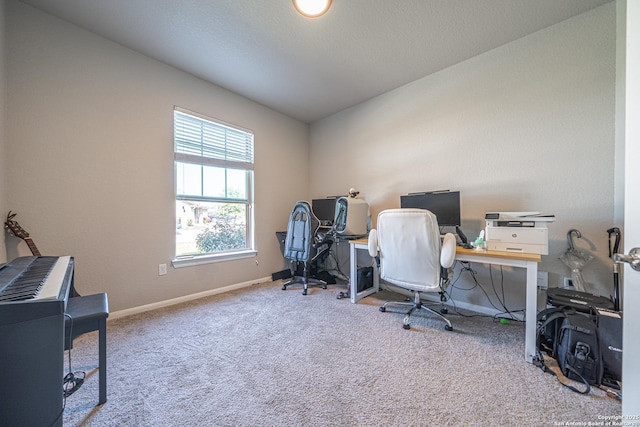 carpeted office space featuring baseboards