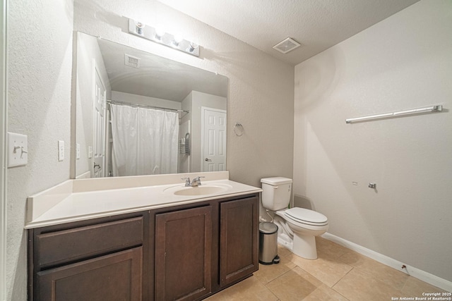 bathroom with toilet, tile patterned floors, visible vents, and vanity