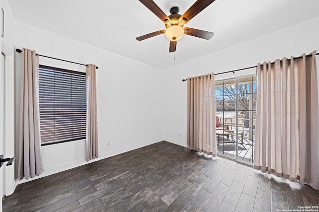 unfurnished room featuring ceiling fan, baseboards, and wood finished floors