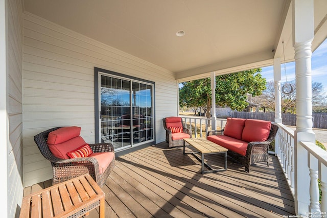 deck featuring outdoor lounge area