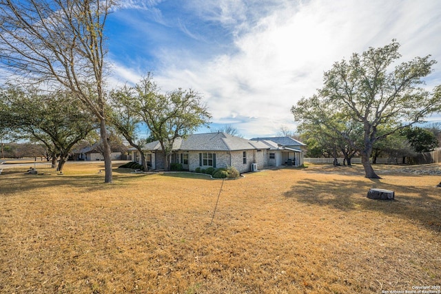 ranch-style home with a front lawn