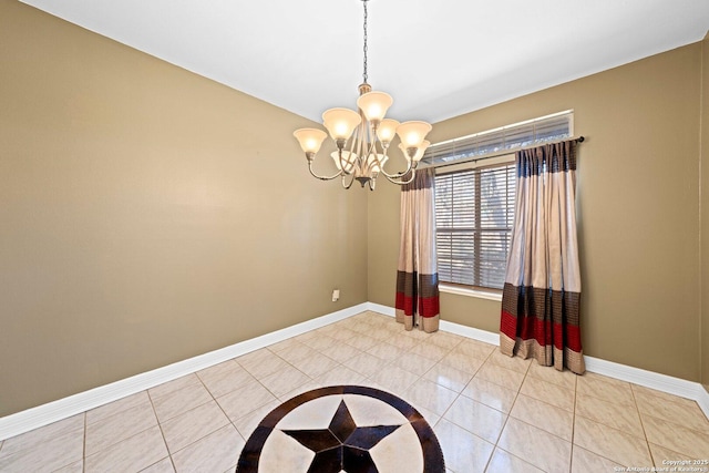 unfurnished room featuring a chandelier, light tile patterned flooring, and baseboards