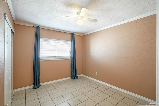 spare room with baseboards, a ceiling fan, and crown molding