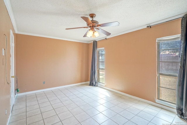 empty room with crown molding, light tile patterned floors, ceiling fan, a textured ceiling, and baseboards