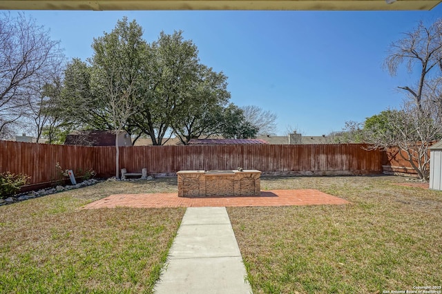 view of yard featuring a patio area and a fenced backyard