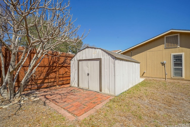 view of shed with a fenced backyard