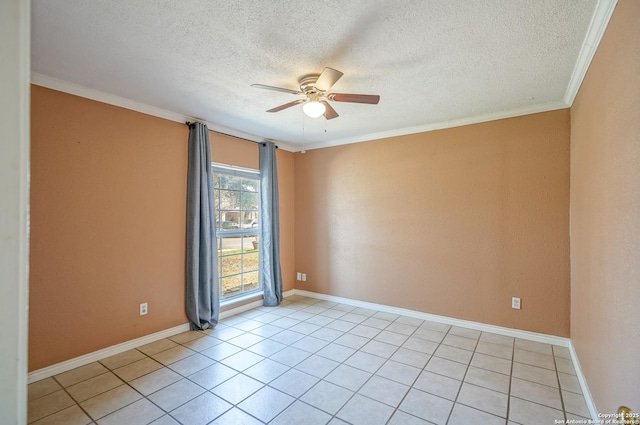 spare room featuring light tile patterned floors, ornamental molding, a ceiling fan, and baseboards