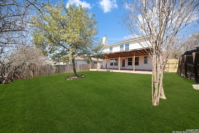 view of yard featuring a patio and a fenced backyard