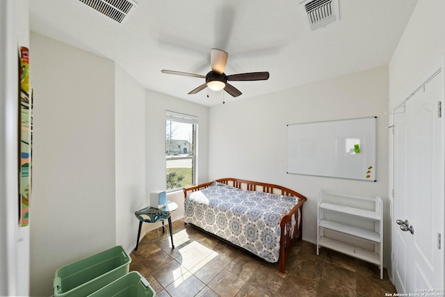 bedroom featuring ceiling fan, visible vents, and baseboards