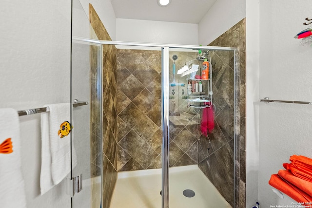 full bathroom featuring a shower stall