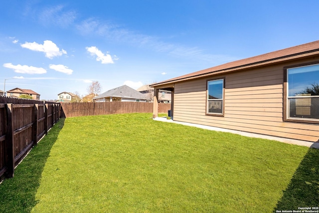 view of yard with a fenced backyard