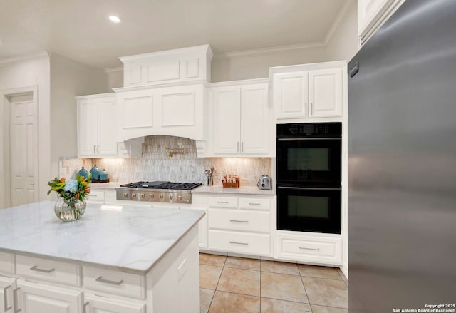 kitchen with light tile patterned floors, crown molding, stainless steel appliances, and backsplash