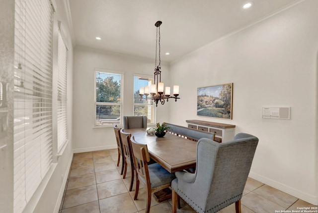 dining space with recessed lighting, an inviting chandelier, and baseboards