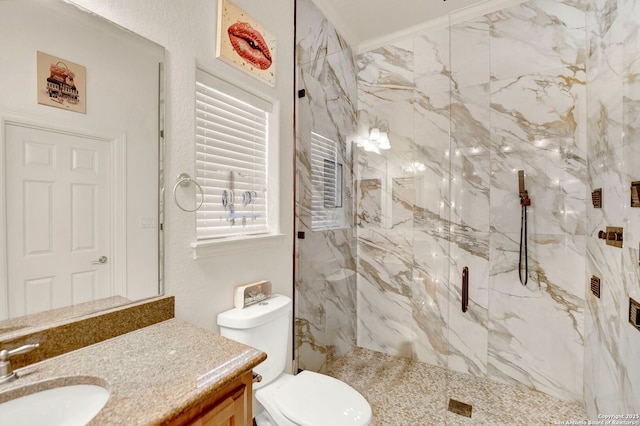 bathroom with toilet, a marble finish shower, ornamental molding, and vanity