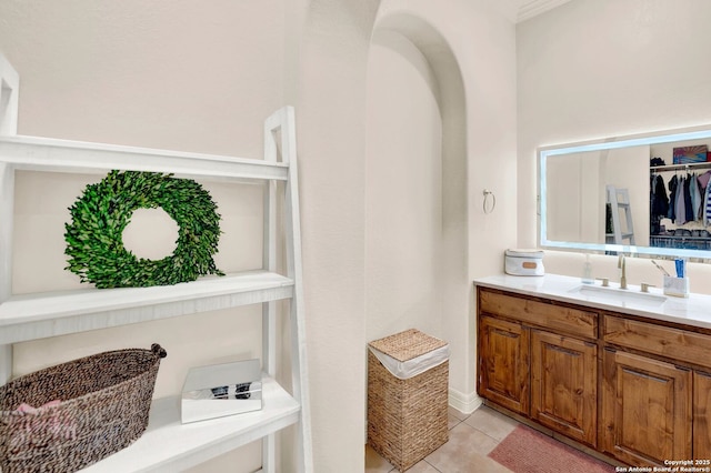 bathroom with tile patterned flooring and vanity