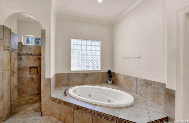 full bath with a tub with jets, walk in shower, a wealth of natural light, and crown molding