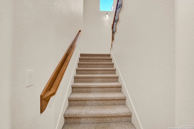 stairway with baseboards