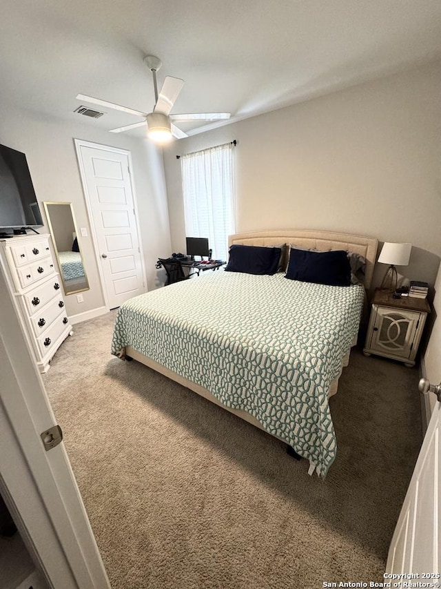 bedroom featuring ceiling fan, carpet floors, and visible vents