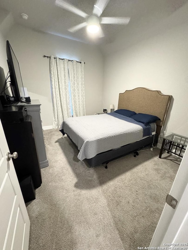 bedroom with carpet flooring, ceiling fan, and baseboards