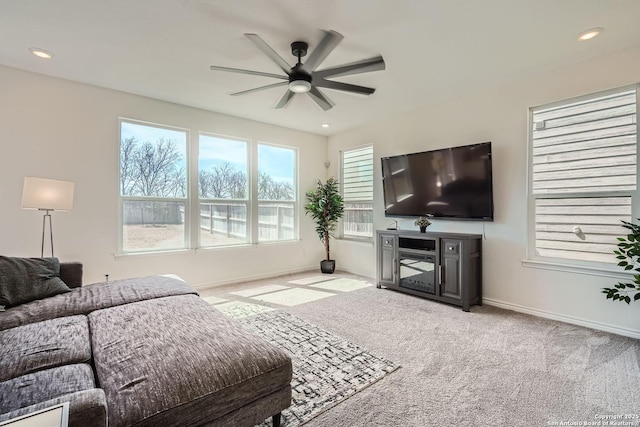 carpeted living room featuring recessed lighting, a ceiling fan, and baseboards